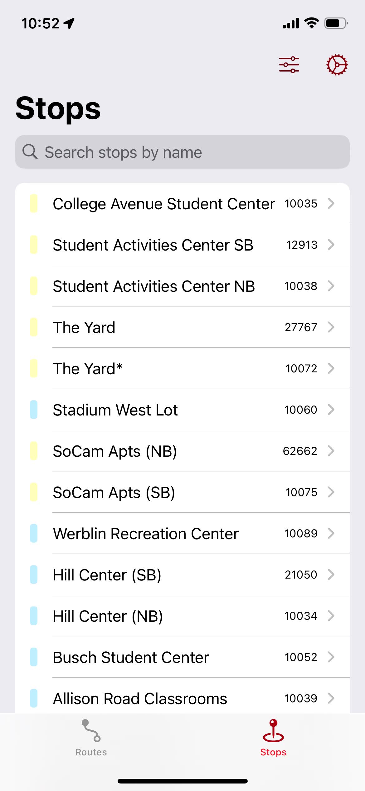 The &ldquo;Stops&rdquo; tab in an early version of RURadar, showing stops with their campus color, and a debug stop ID on the right.